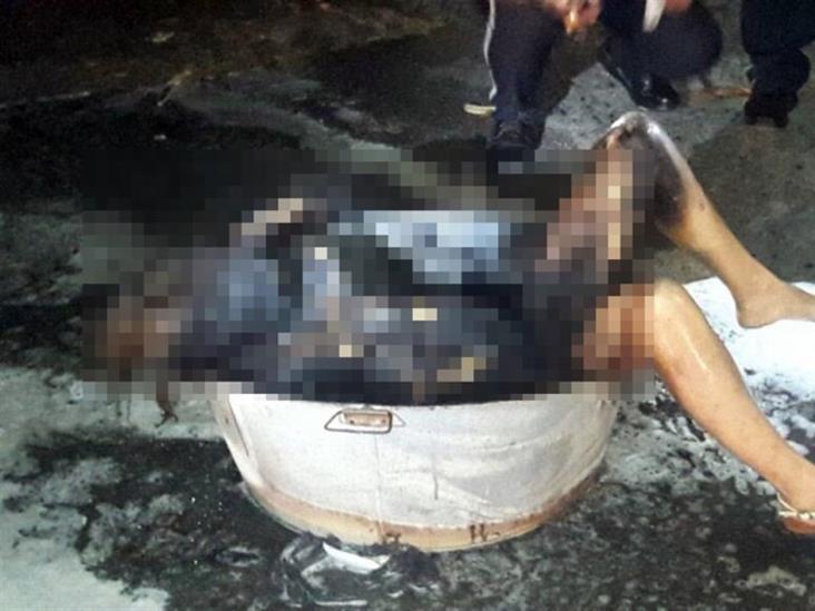 Calcinan a mujer en recipiente metálico Calcinan a mujer en recipiente metálico