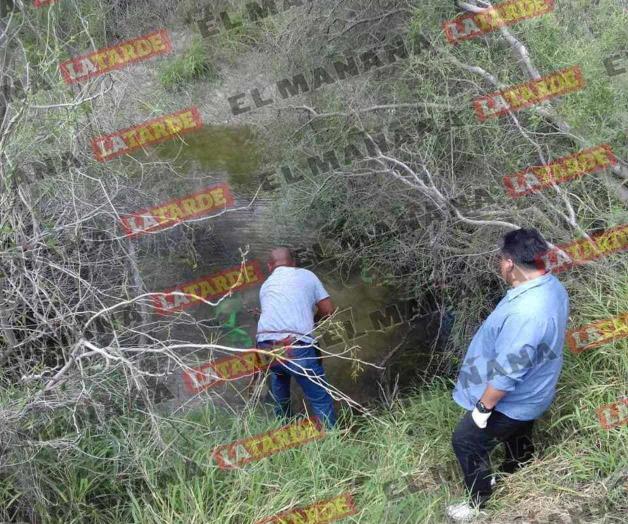 Localizan cadáver enterrado bajo el agua de un canal de riego