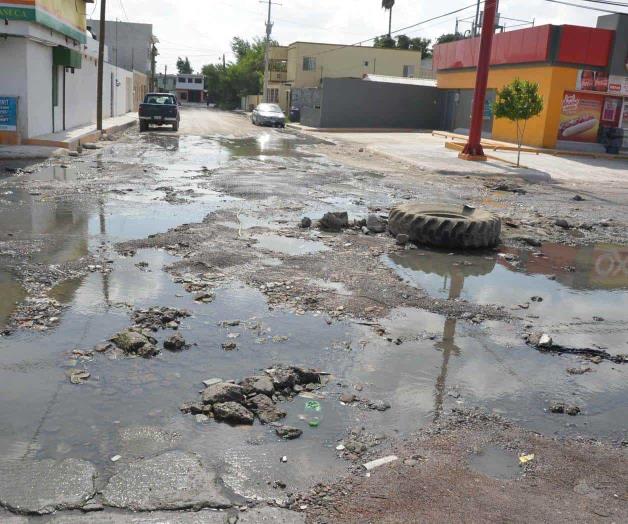 Baches, charcos y malos olores Baches, charcos y malos olores