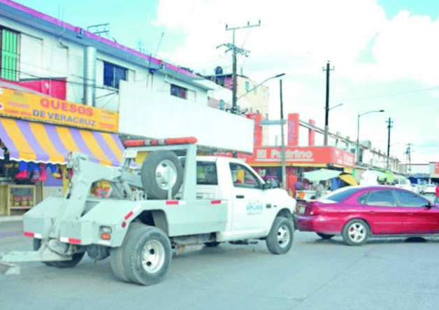Frenan operativos de grúas en comercios Frenan operativos de grúas en comercios
